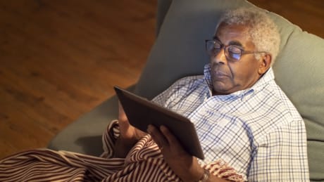 Man resting on couch.