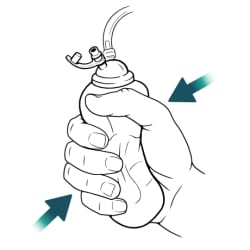 Hand wrapped around bulb, squeezing it.