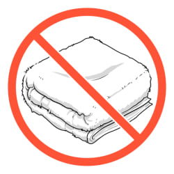 Clean folded towel inside prohibition symbol.