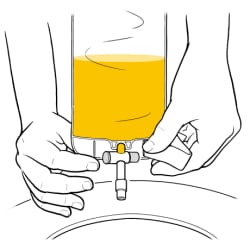 Hands holding catheter bag half full of urine over toilet.