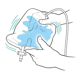 Hands holding catheter bag with water inside while shaking bag.