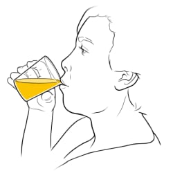 Person drinking from a cup of liquid.