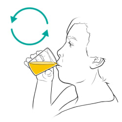 Person drinking again from cup of liquid. 