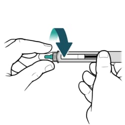 One hand holding insulin pen and other hand turning new needle until tightly attached to pen.
