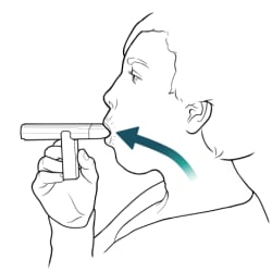 Person holding peak flow meter to mouth, with lips closed around mouthpiece, and breathing out.