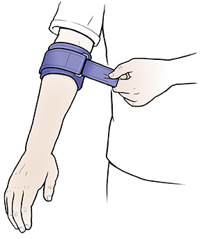 Closeup of hand fastening tennis elbow splint below opposite elbow.