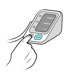Finger pressing power button on monitor.