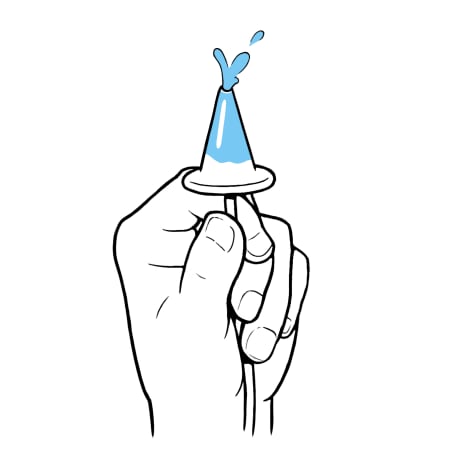 Hand holding end of tubing with cone upright and water coming out of cone end.